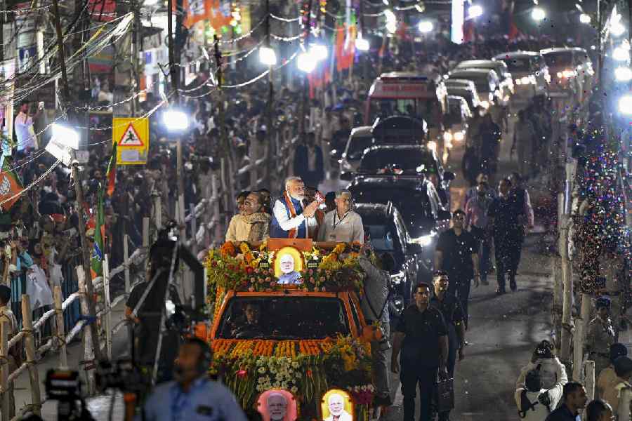Prime Minister Narendra Modi, Union Minister Rajiv Ranjan alias Lalan Singh and Bihar BJP President Dilip Kumar Jaiswal during an election roadshow for the Bihar Assembly polls, in Patna, Sunday, Nov. 2, 2025.
