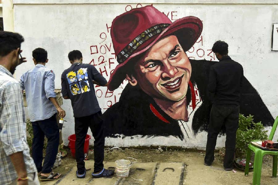 Artists paint a mural of deceased singer Zubeen Garg, in Guwahati.