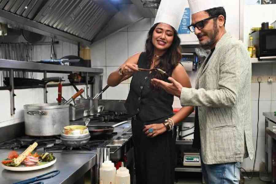 Sohini Sarkar and Ritwick Chakraborty pose for a picture in the kitchen of Warehouse Cafe in South City Mall 