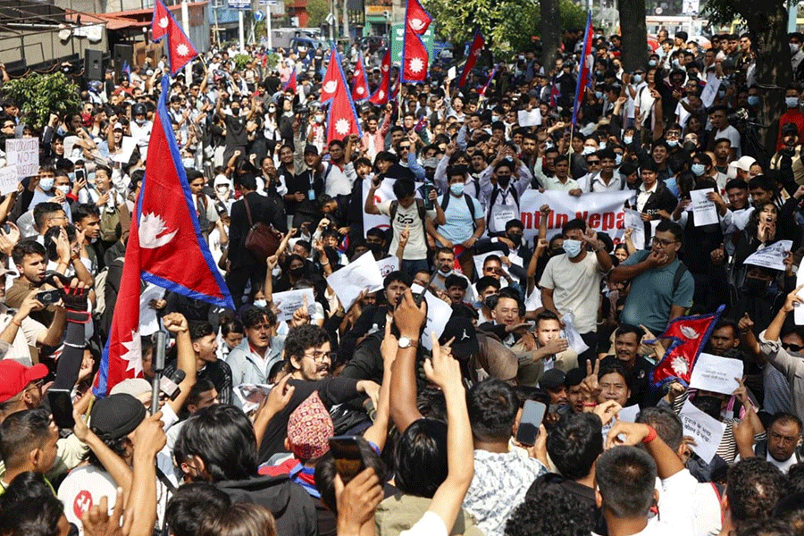 People take part in anti-corruption protests that toppled the government, in Kathmandu