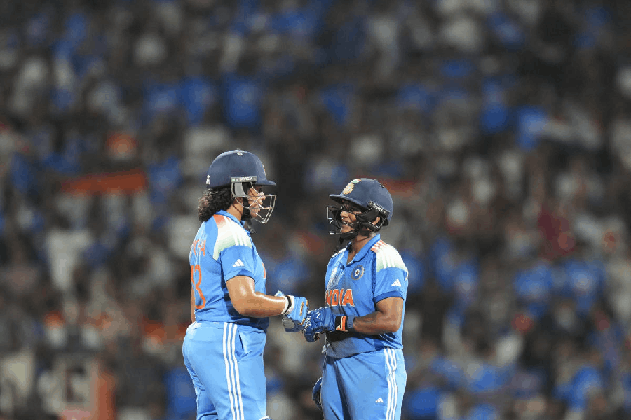 India's Deepti Sharma celebrates her half century with Richa Ghosh during the ICC Women's World Cup final ODI cricket match between India Women and South Africa Women, at the DY Patil Stadium, in Navi Mumbai, Sunday, Nov. 2, 2025.