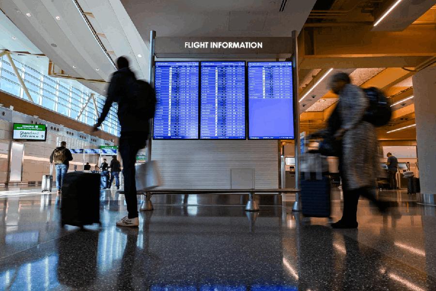 File photo: Travelers walk through the Washington DC airport.