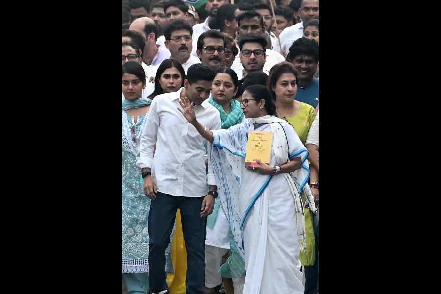 Mamata Banerjee and Abhishek Banerjee at the protest rally from Red Road to Jorasanko Thakurbari against the SIR on Tuesday.