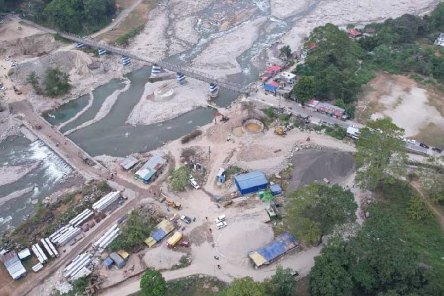 An aerial view of the under-construction bridge (left) over the Balason river in Mirik