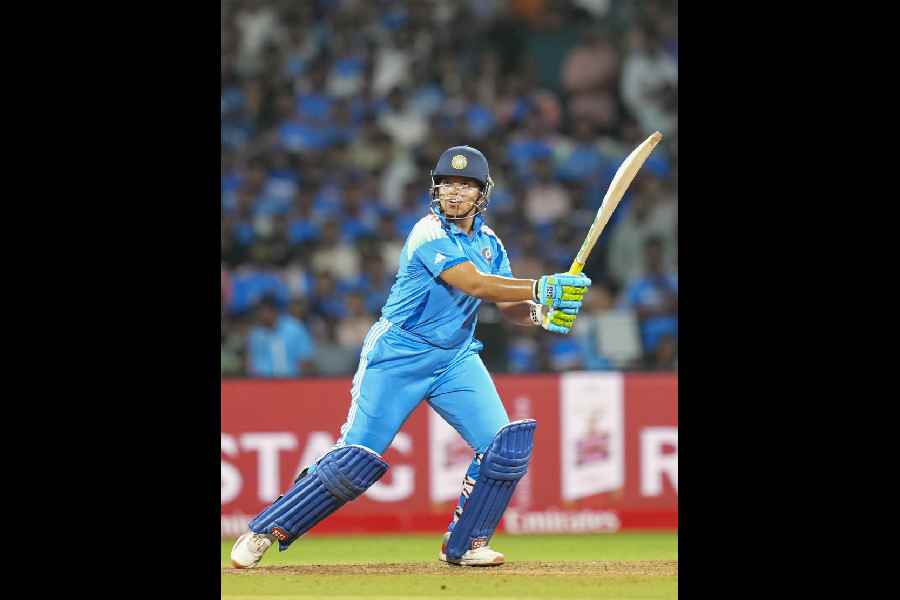 Richa’s parents Manabendra and Swapna Ghosh flash the victory sign at their residence in Siliguri on Wednesday. 