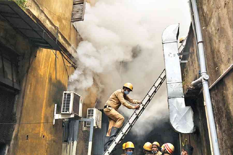 Firefighters outside the building on RN Mukherjee Road on Thursday