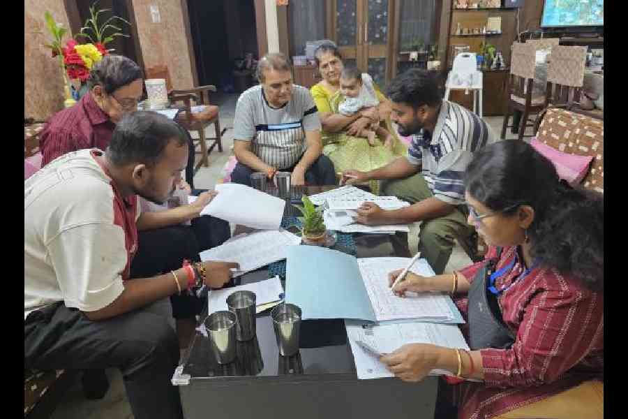 SIR forms being distributed at a house in CL Block on Tuesday