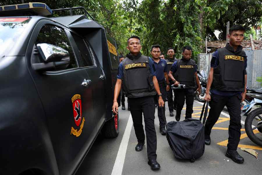 Indonesian military Combat Engineering Detachment (Denzipur) personnel carrying explosive detection equipment arrive after an explosion occurred at a school complex in Jakarta, Indonesia