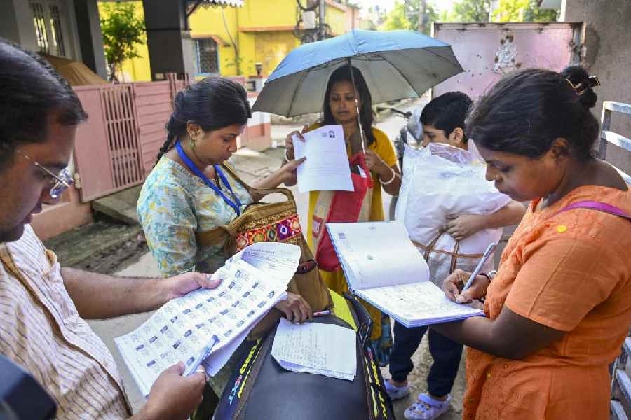 Booth Level Officers on field to distribute enumeration forms to voters as the Special Intensive Revision (SIR) of election rolls begins in West Bengal, at Balurghat in Dakshin Dinajpur district