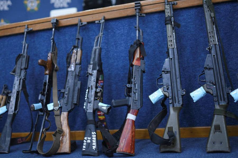 Officials display firearms during a press conference, which the police said were captured during what was the deadliest police operation in Brazil's history, in Rio de Janeiro, Brazil, October 29, 2025.