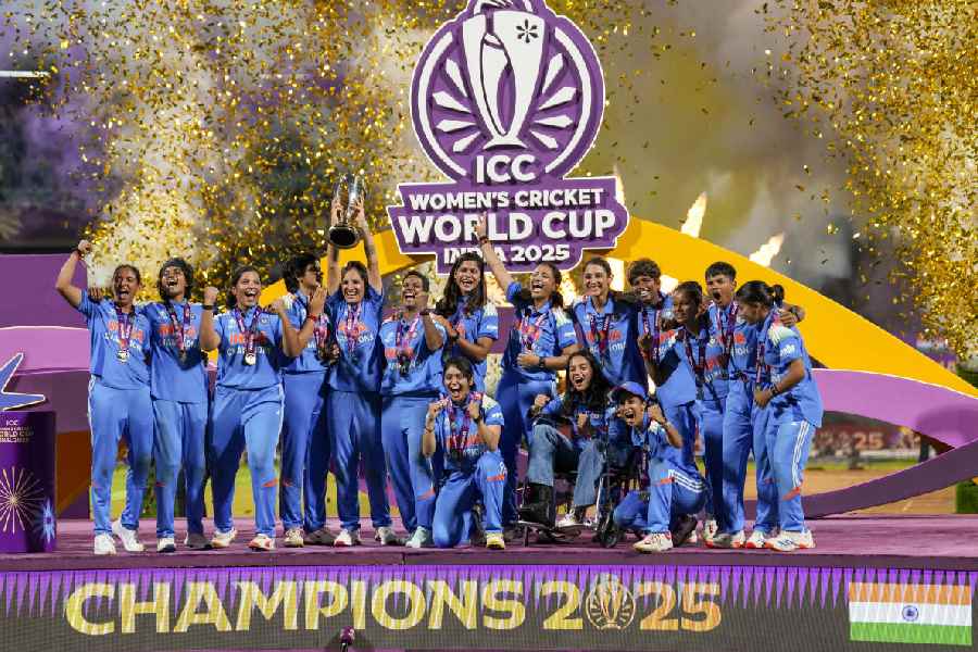 India’s players celebrate with the trophy during the presentation ceremony after winning the ICC Women's World Cup 2025, at the DY Patil Stadium, in Navi Mumbai, early Monday, Nov. 3, 2025