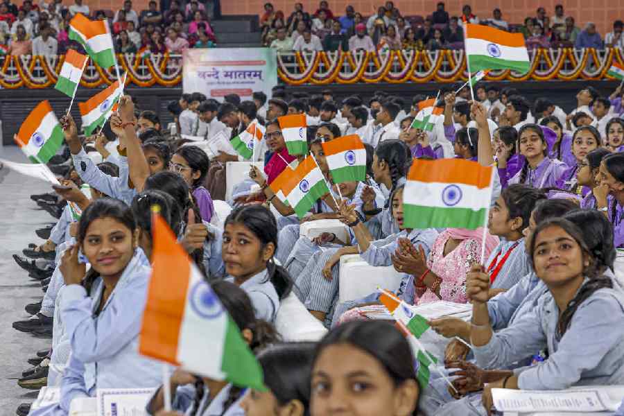 School children and other attendees during an event marking 150 years of the national song ‘Vande Mataram’, at the Indira Gandhi Indoor (IGI) Stadium, in New Delhi.