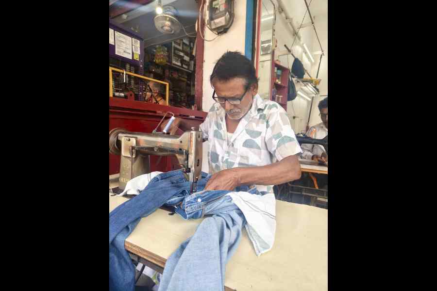 Tailor Raju Kumar at Purnea’s Vikas Market. Raju prefers working in Delhi because of better wages.