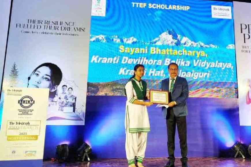 Sayani Bhattacharya of Kranti Devijhora Balika Vidyalaya, Jalpaiguri, receives the TTEF scholarship on Friday. Picture by Passang Yolmo