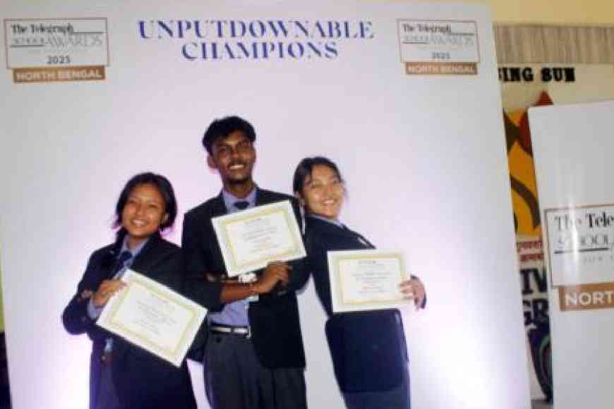 Students pose before a selfie zone with their certificates at the third edition of the IIHM Presents The Telegraph School Awards for Excellence 2025 North Bengal, held in association with The Bhawanipur Education Society College and PCM Group, and co-sponsored by SiP Abacus, at Birla Divya Jyoti School, in Uttarayon, Siliguri, on Friday. Pictures by Passang Yolmo