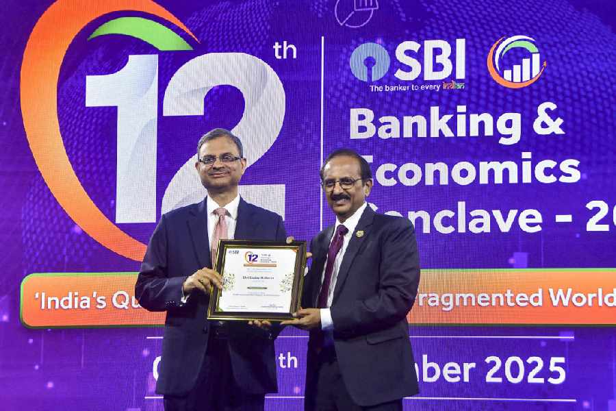 RBI governor Sanjay Malhotra (left) with SBI chairman Challa Sreenivasulu Setty in Mumbai on Friday.