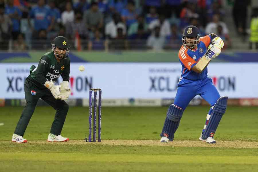 Suryakumar Yadav plays a shot during the Asia Cup cricket match between India and Pakistan at Dubai International Cricket Stadium.