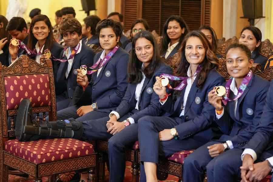 National women's cricket team members, front row from left, Deepti Sharma, Radha Yadav, Arundhati Reddy, Shafali Verma, Pratika Rawal, Renuka Singh and Uma Chetry with others during a meeting with President Droupadi Murmu following their victory in the ODI World Cup, at Rashtrapati Bhavan, in New Delhi