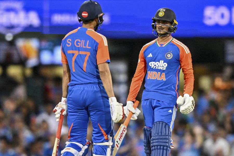 India's Shubman Gill and Abhishek Sharma react after their 50 runs partnership during the fifth T20I cricket match of a series between India and Australia, in Brisbane, Australia, Saturday, Nov. 8, 2025.