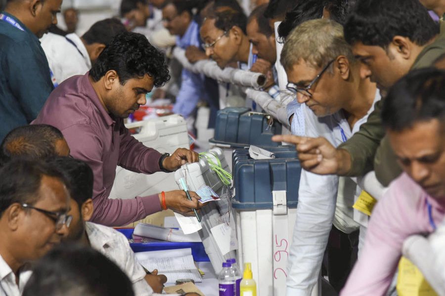 Polling officials submit the EVMs and VVPATs at a collection centre after the first phase of the Bihar Assembly elections, in Patna, Thursday, Nov. 6, 2025.