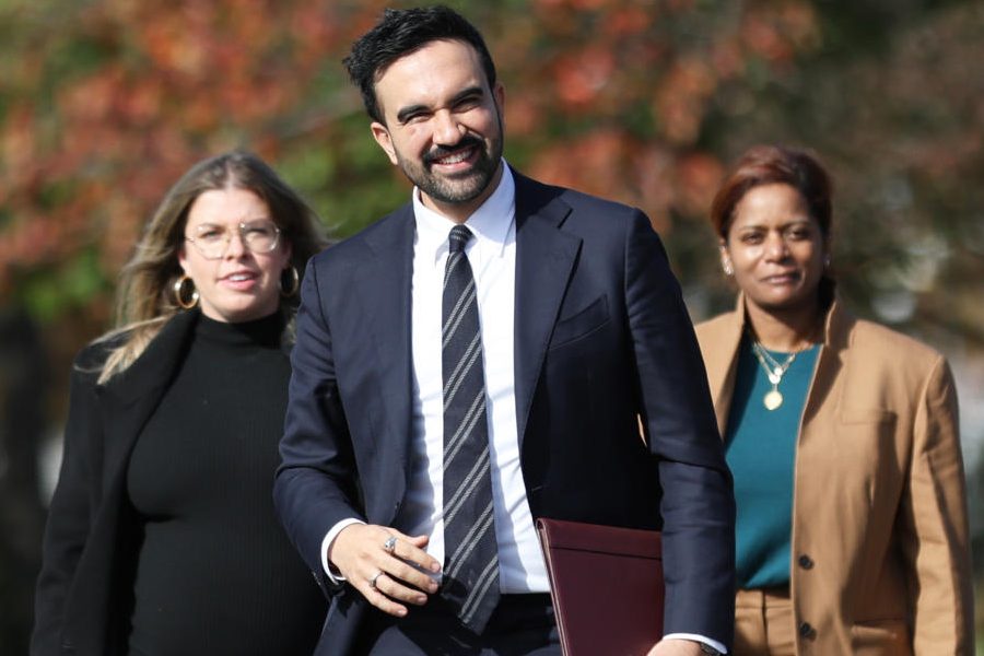 New York City mayor-elect Zohran Mamdani, center, walks with members of his transition team including Elana Leopold, left, and Melanie Hartzog for a news conference in the Queens borough of New York, Wednesday, Nov. 5, 2025.