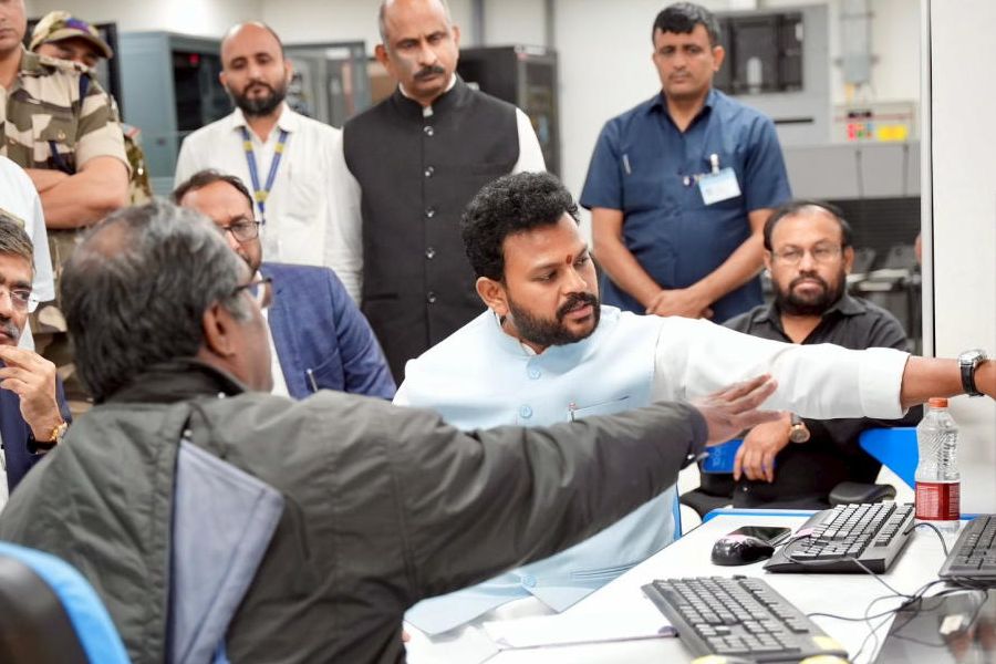 In this image posted on Nov. 8, 2025, Union Minister of Civil Aviation Rammohan Naidu visits the ATC Tower to review operations after the technical glitch in the ATC messaging system at Delhi airport.