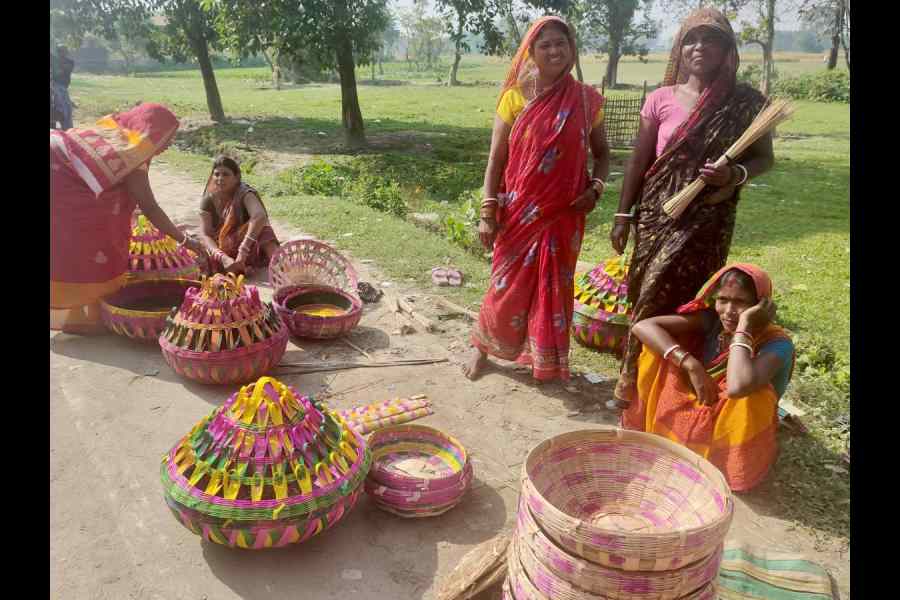 Women selling bamboo baskets at Bada Idgah in Bihar's Amour constituency on Nov 7.