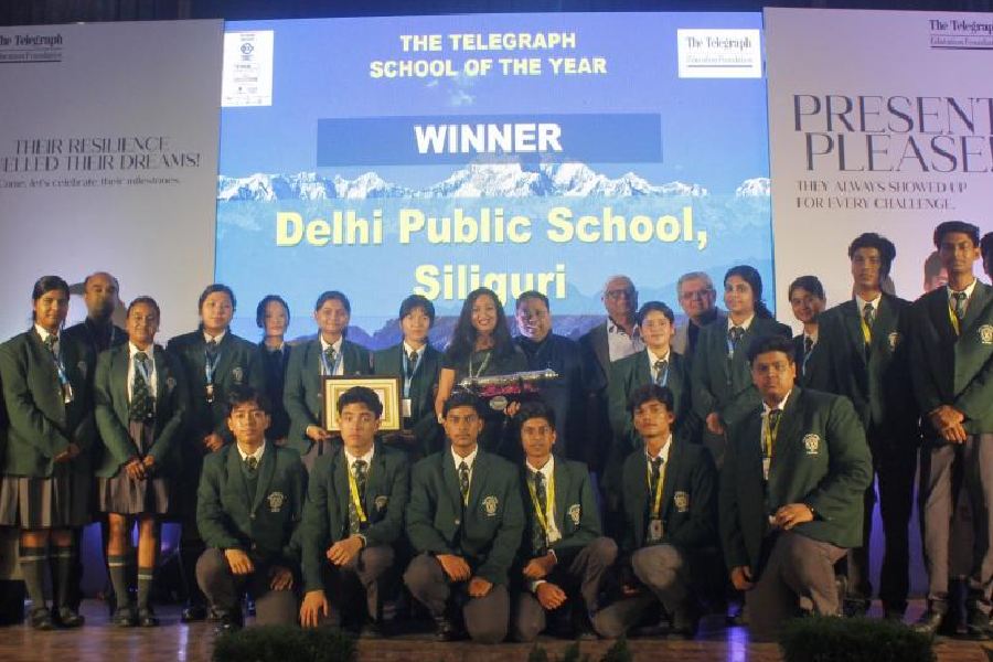 Teachers and students of Delhi Public School, Siliguri, with the School of the Year Award in Siliguri on Saturday. 