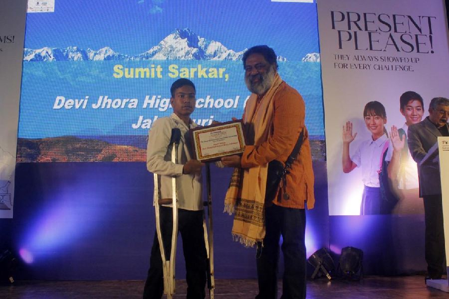 Sumit Sarkar receives the scholarship from Supratim (Raj) Basu