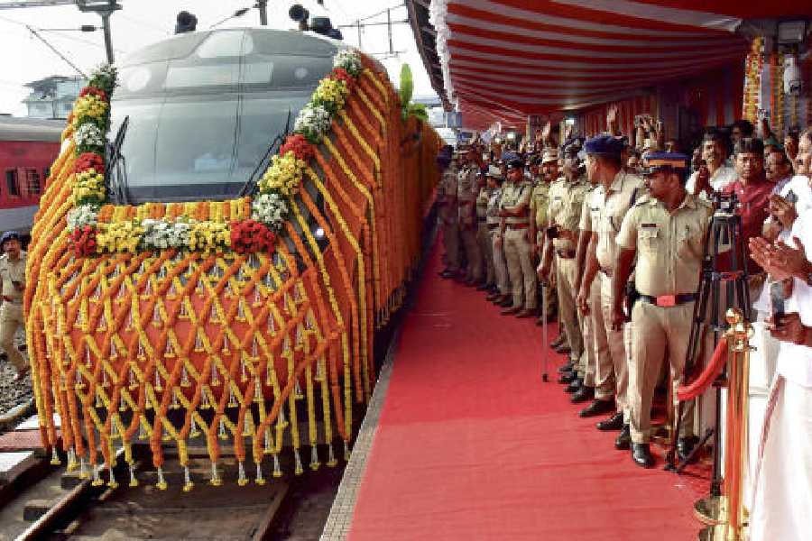 Security personnel keep vigil as a new Vande Bharat train leaves the Ernakulam South railway station in Kerala following its virtual flag-off by Prime Minister Narendra Modi on Saturday.