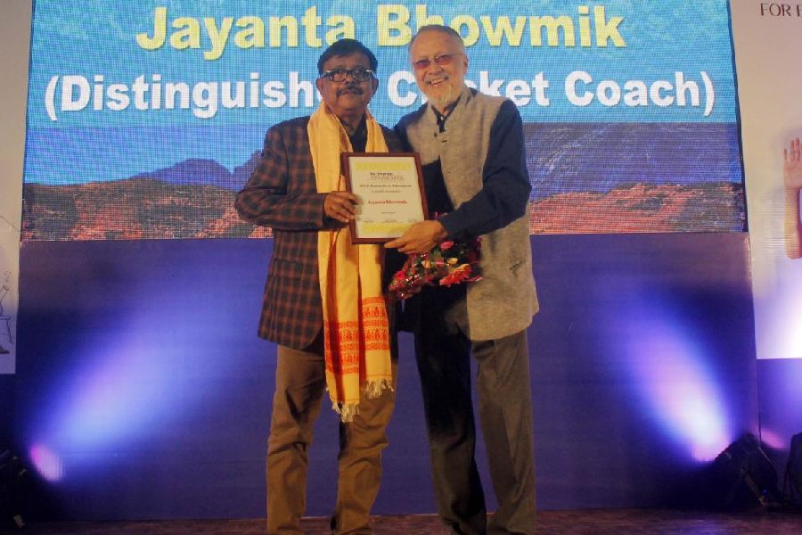 Cricket coach Jayanta Bhowmik receives The TTEF Honour for an Educationist in Siliguri on Friday. 
