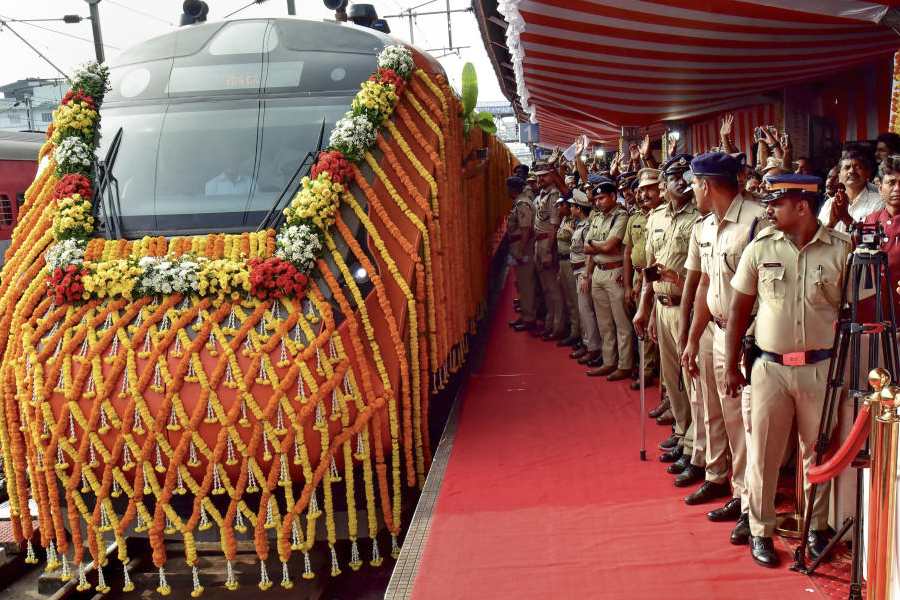 Security personnel keep vigil as a new Vande Bharat train leaves the Ernakulam South railway station following its virtual flag-off by Prime Minister Narendra Modi, in Ernakulam, Kerala, Saturday, Nov. 8, 2025.