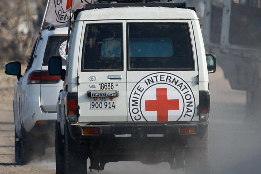 Red Cross vehicles transport a body, identified by Hamas as deceased Israeli soldier Hadar Goldin, in Deir Al-Balah, central Gaza Strip, November 9, 2025.