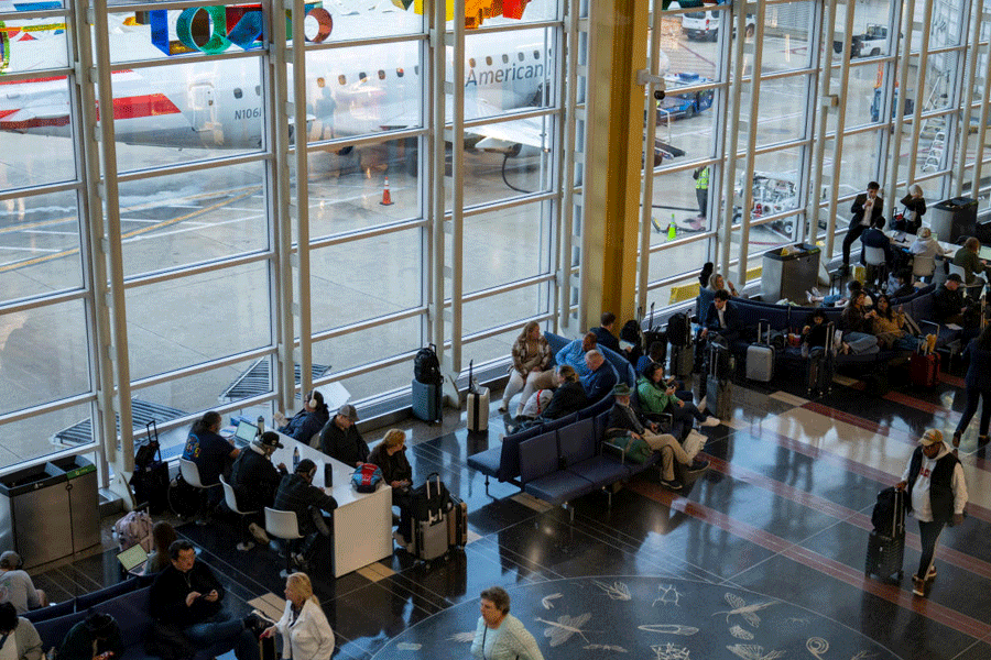 Travellers wait for their flights at Ronald Reagan Washington National Airport, more than a month into the ongoing U.S. government shutdown, in Arlington, Virginia, U.S., November 9, 2025.