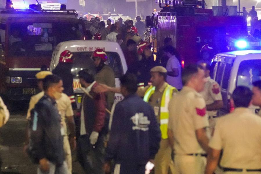Emergency services personnel at the spot after a blast occurred in a parked car near Red Fort, in New Delhi, Monday, Nov. 10, 2025.