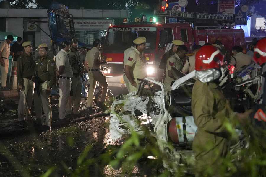 Police personnel at the spot after a blast occurred in a parked car near Red Fort, in New Delhi
