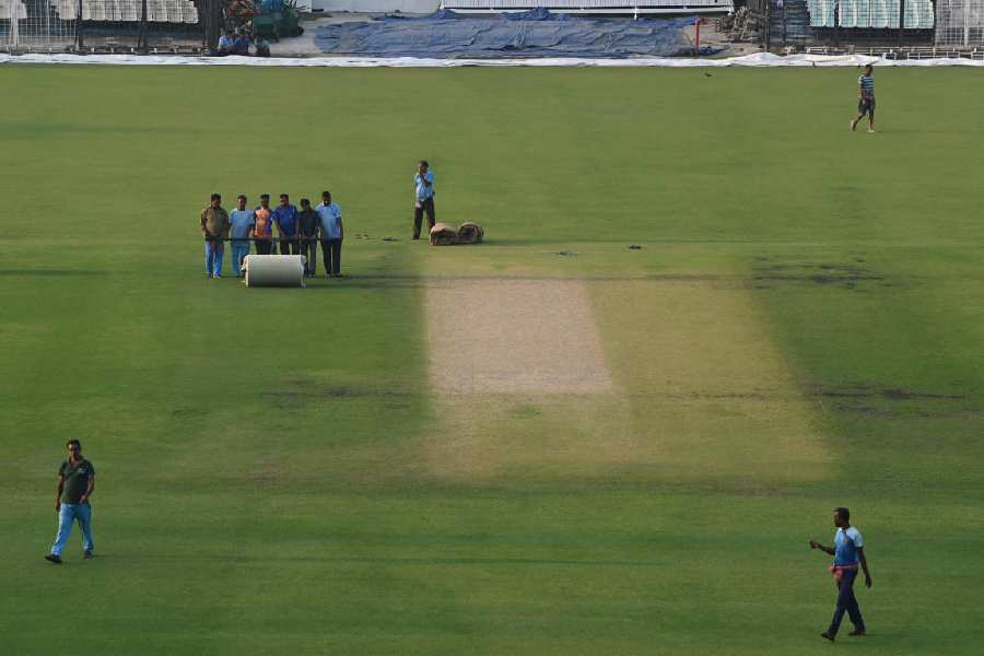 Ground staff busy working on the pitches at Eden Gardens on Monday. The India-South Africa Test starts on Friday.
