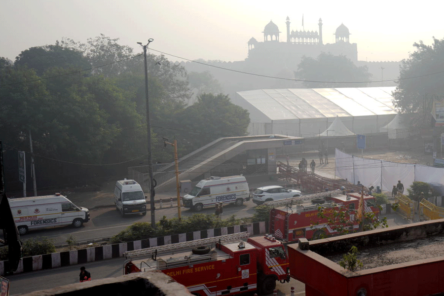 Forensic vehicles at the site in the aftermath of the blast that occurred near Red Fort Metro Station on Monday, killing at least nine people and gutting several vehicles, in New Delhi, Tuesday, Nov. 11, 2025.