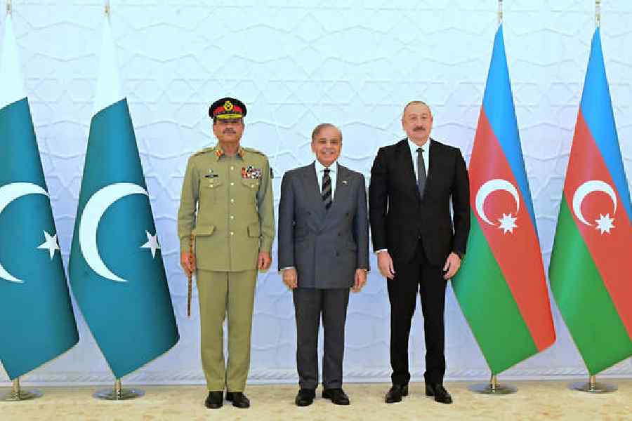 Pakistan Prime Minister Shehbaz Sharif stands alongside Azerbaijan’s President Ilham Aliyev during an official visit to the landlocked Caucasian country. But there is a third person in the photo: Pakistan’s newly minted Field Marshal Asim Munir.