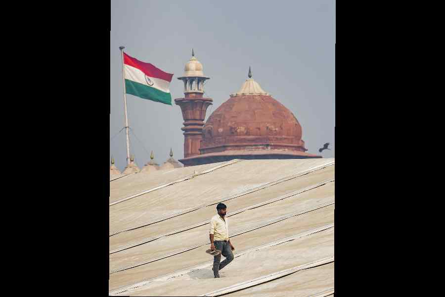 A man walks on the roof of a tent set up near the Red Fort on Tuesday.