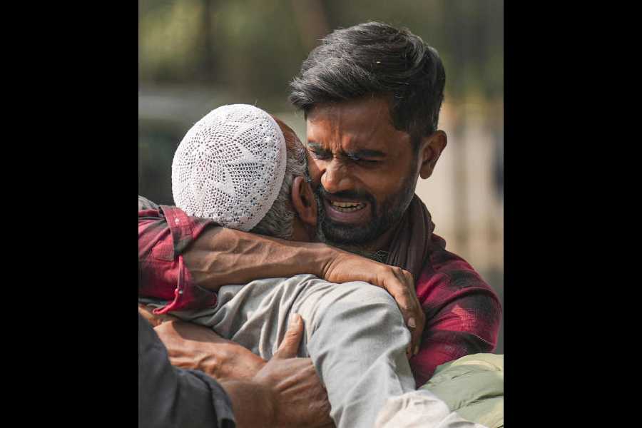 Relatives of Mohammad Noman, one of the Red Fort blast victims, outside a mortuary in New Delhi on Tuesday. 
