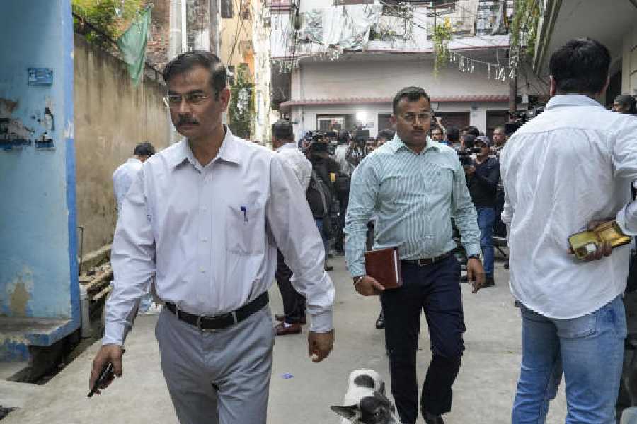 Security officers at the residence of Shaheen Sayeed in Lucknow on Tuesday.