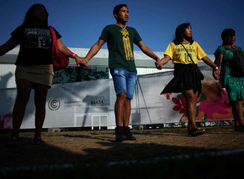 Indigenous people attend a protest outside the United Nations Climate Change Conference (COP30) in Belem, Brazil