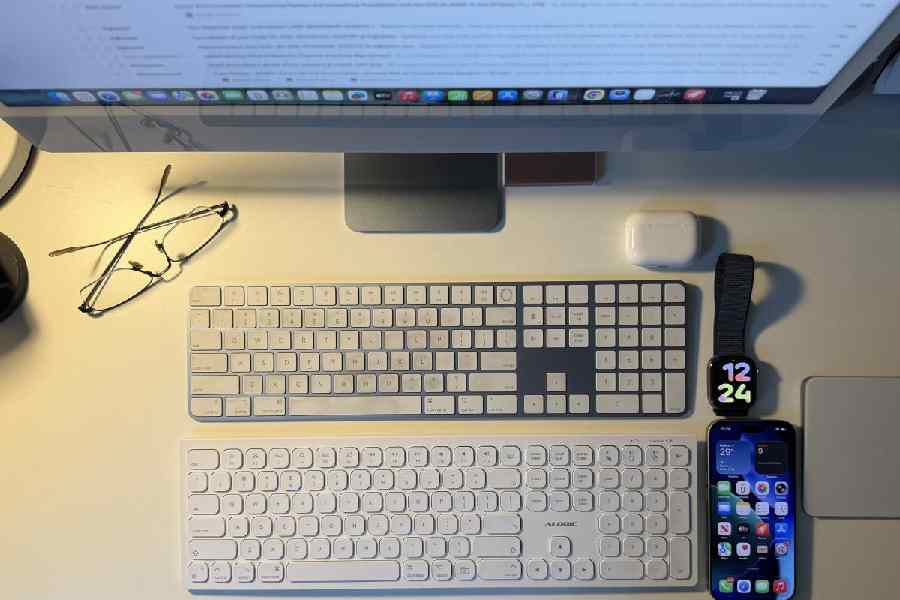 It’s a full-size keyboard that can switch between three devices. Seen here with Apple’s Magic Keyboard