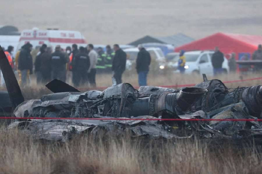 Members of emergency services work at the site of the Turkish C-130 military cargo plane crash near the Azerbaijani border, in Sighnaghi municipality, Georgia