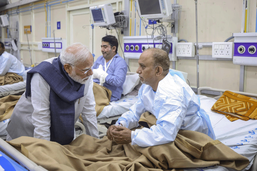 Prime Minister Narendra Modi meets an injured victim undergoing treatment at LNJP hospital following a blast near the Red Fort, in New Delhi.