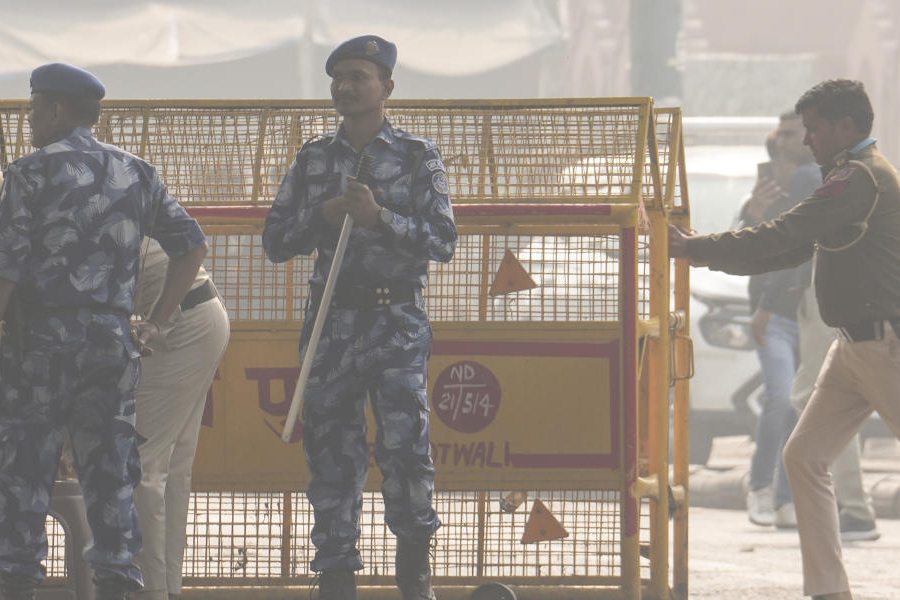 Security personnel keep vigil in a cordon off area near Red Fort after a blast on Monday that claimed the lives of 12 people and injured several, in New Delhi, Wednesday, Nov. 12, 2025.