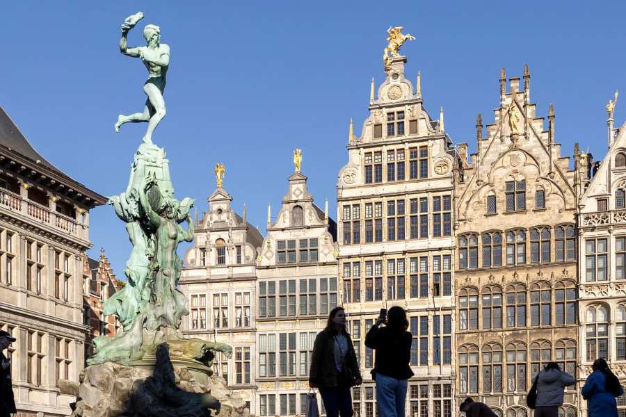 People stroll through the Grand Place (Grote Markt) near the Brabo Fountain in Antwerp, Belgium November 7, 2025.