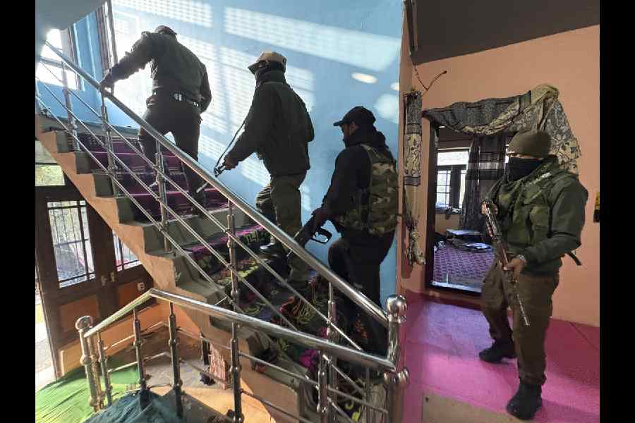 Security personnel during a crackdown on the banned Jamaat-e-Islami in Kulgam on Wednesday.