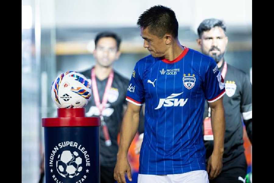 Bengaluru FC's Sunil Chhetri looks at the match-ball before an ISL game. Footballers are staring at a bleak future as the No. 1 league in the country is yet to take off. 